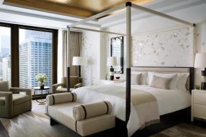 a hotel room with two beds and a large window at The Langham Chicago in Chicago