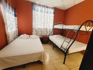 Postel nebo postele na pokoji v ubytování Villalobos Hotel Managua