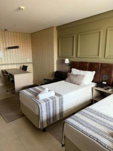 Una cama o camas en una habitación de Inova