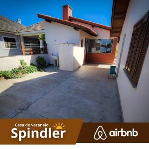 a driveway in front of a house at Spindler summer house in Tramandaí