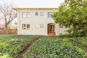 a white house with a large yard at 1 Berkeley - Entire Apartment - Private, Spacious in Berkeley