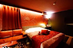 Ένα ή περισσότερα κρεβάτια σε δωμάτιο στο Hotel TOSCANA - Adult Only