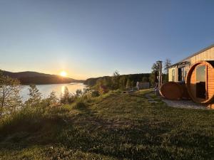a view of the sun setting over a river at Feriendorf Seeblick - Tiny Chalet Nr 6 in Neunburg vorm Wald