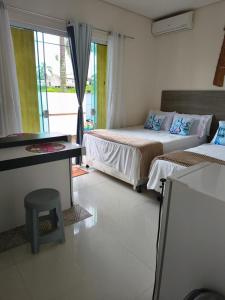 En eller flere senge i et værelse på Pousada Mulher Do Mar