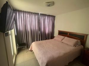 Giường trong phòng chung tại Algarrobo Norte Mirasol Apartmento +29 ảnh