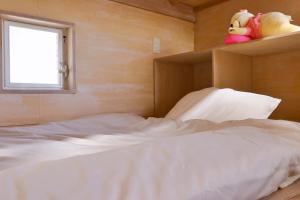 Postel nebo postele na pokoji v ubytování ペスカドール + 8 fotografií