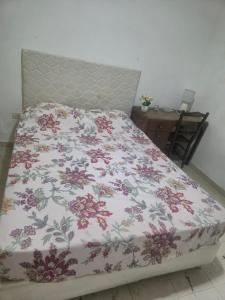 En eller flere senge i et værelse på Alojamiento Taibor