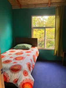 En eller flere senge i et værelse på Cabaña El Descanso del Águila