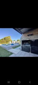 a picture of a building with a fireplace at Aires Verdes in General Pico