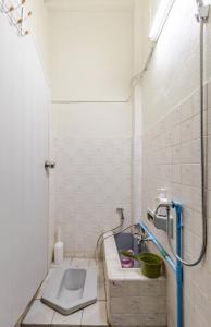 a small bathroom with a sink and a toilet at Bang Chak Studio in Bangkok +14 photos