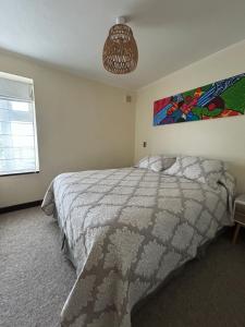 En eller flere senge i et værelse på Departamento Bellavista