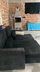 Χώρος καθιστικού στο Casa a 3 minutos andando para a lagoa da praia do sudoeste