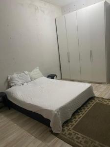 Ένα ή περισσότερα κρεβάτια σε δωμάτιο στο Casa a 3 minutos andando para a lagoa da praia do sudoeste