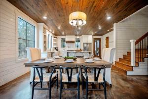 a dining room with a large wooden table and chairs at Amazing Views Hot Tub Fire Pit Dog Friendly in Stephens Gap