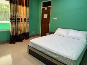 Postel nebo postele na pokoji v ubytování Coconut Palm Dhidhoo