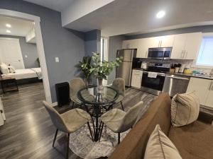a living room with a couch and a glass table at Beautiful newly designed Luxurious Apartment in Windsor