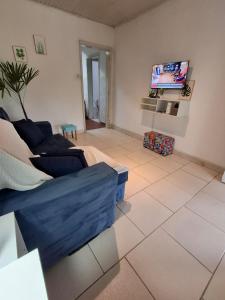 TV a/nebo společenská místnost v ubytování Casa no Centro Livramento - Rivera perto Freeshop