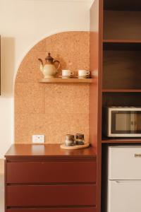 Kuchyň nebo kuchyňský kout v ubytování The Alluna Motel, an Ascend Collection Hotel