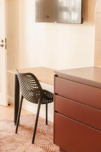 TV a/nebo společenská místnost v ubytování The Alluna Motel, an Ascend Collection Hotel