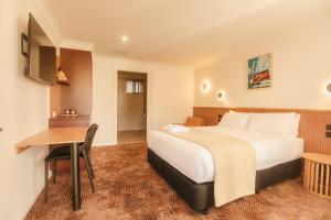 Postel nebo postele na pokoji v ubytování The Alluna Motel, an Ascend Collection Hotel + 122 fotografií