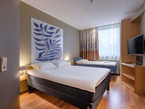 Postel nebo postele na pokoji v ubytování ibis Heilbronn City + 153 fotografií