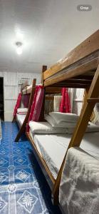 a group of bunk beds in a room at Hondelz Budget Homestay in Busuanga