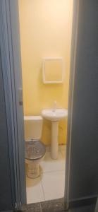 a bathroom with a toilet and a sink at Boa opção in Manaus +15 photos