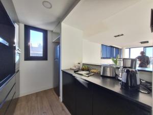 Køkken eller tekøkken på EG12 Playa Grande Aloha Host