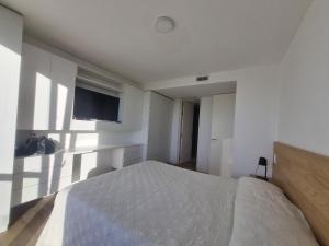 En eller flere senge i et værelse på EG12 Playa Grande Aloha Host + 15 billeder