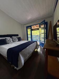 Postel nebo postele na pokoji v ubytování Pousada Dom Luiz