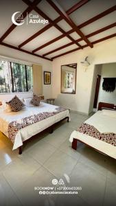 a bedroom with two beds in a room at Cabañas Casa Luna in Rivera