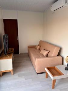 a living room with a couch and a table at Tres de Mayo in San Luis