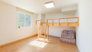 Postel nebo postele na pokoji v ubytování Ganghwa Rodemhouse Pension