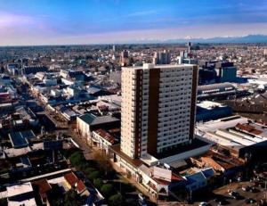 an aerial view of a city with a tall building at Moderno 1704 Depto en el Centro de Chillan con estacionamiento in Chillán