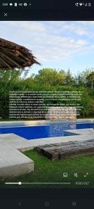 a wall of words on the side of a swimming pool at Casa Quinta in Mercedes