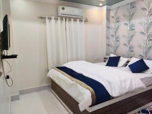 Postel nebo postele na pokoji v ubytování Hotel G Diamond