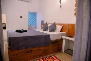 Postel nebo postele na pokoji v ubytování Hiriketiya First In Rest