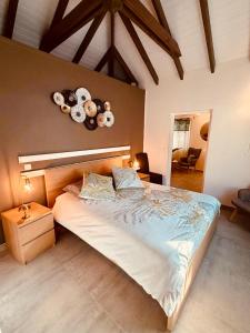 a bedroom with a large bed with teddy bears on the wall at Orient bay Ti COCON au calme avec citerne in Orient Bay