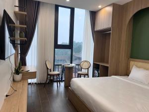 Postel nebo postele na pokoji v ubytování Hiden An Hotel + 6 fotografií