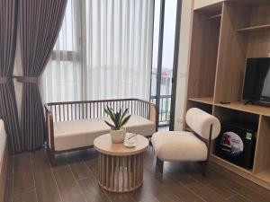 a living room with a couch and a table at Hiden An Hotel in Ninh Binh +17 photos