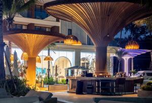 a lobby with domed ceilings and tables in a building at Kora 2br pool Apartment in Layan Beach