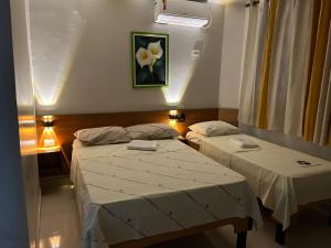 Postel nebo postele na pokoji v ubytování Hotel Tropicália próximo a 25 de março , Brás e Bom Retiro "Com estacionamento conveniado ao lado do hotel"