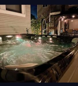a large jacuzzi bathtub with lights in it at Garden Suite- Private Deck, Hot Tub & Fast WiFi in Vallejo