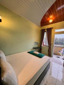 En eller flere senge i et værelse på Ingan Cio Homestay