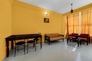 Posezení v ubytování Super Collection O KSRTC Bus Station Kottayam Formerly Hotel O Day Springs + 23 fotografií