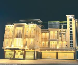 Alodia Powered by Archipelago في Tanjungkarang: مبنى مضاء عليه لافتة "آنيا"