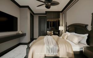 May Boutique DongVan Hotel في دونغ فان: غرفة نوم بسرير كبير مع مروحة سقف