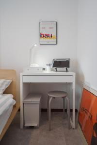 a white desk with a chair next to a bed at 3min walk to Asagaya Sta, Cozy Private Studio Direct access 8min to Shinjuku, 30min to Akihabara and Asakusa in Tokyo
