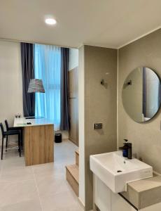 a bathroom with a white sink and a mirror at Namsan Dream City in Seoul +49 photos