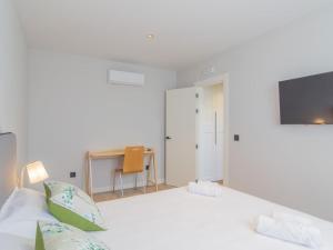 En eller flere senge i et værelse på Apartamento Mar Salada Rosamunda